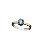 Montana Sapphire Gold & Silver Ring. I cut this beautiful Blue Montana sapphire in a design called ‘Classic’. The sapphire is 8/10th of a carat and the stone is unusually clear with great brilliance as a result. Set in 18K gold with a 14K textured narrow gold band over silver. Ring is size 6 ¾ .