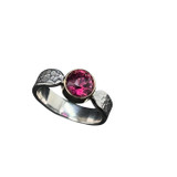 Pink Tourmaline Ring in 18K gold and silver. I faceted this hot pink tourmaline crystal from Afghanistan. I created a variation of the ‘Button’ cut design with the table top being in the shape of a square. Very nice color with intense brightness and color saturation. Set in 18K gold bezel and my signature textured pattern silver ring shank with selective polishing. Size 6 ¾ .
