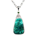 Dioptase Malachite Pendant. I cut this Malachite from Congo with a rare inclusion of blue Dioptase. Interestingly, the stone has a bluish green swirled pattern which makes this stone very unique. A chrome dioptase faceted stone accent matches perfectly and the pattern is hand textured. Includes an 18” sterling chain. 1.5 x 1.25 inches