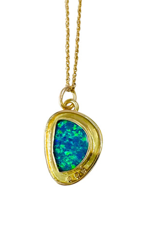 Boulder opal set in 18 and 14K gold