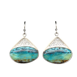Opalized Petrified Wood Earrings 4. This really cool material comes from Indonesia and I cut these unique shapes with a bookend cut technique so the earrings are mirror images of each other. Hand textured with a new technique using diamond point patterning. Ocean themed scene set in a fine silver bezel and sterling silver ear wire components. .75” L by 1”W.