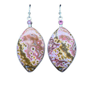 Ocean Jasper Earrings with Tourmaline.
I cut these unique shaped mirror imaged cuts from a beautiful jasper from Indonesia. Sometimes known as River Jasper, the colorful orbs of agate create a pixilation pattern of art. Set in Fine silver bezels and sterling silver components. The pink tourmaline is from Brazil.
1 ¼ “H by ¾ “ W.