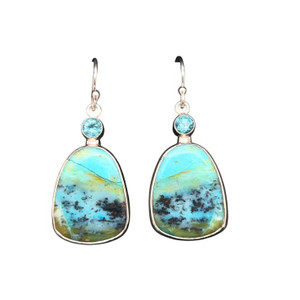 Opalized Petrified Wood Earrings 4. This really cool material comes from Indonesia and I cut these unique shapes with a bookend cut technique so the earrings are mirror images of each other. Blue apatite accents with an ocean themed scene set in a fine silver bezel and sterling silver ear wire components. 1.25” L by 0.75”W.