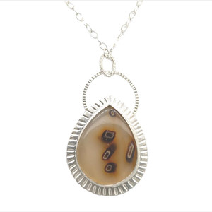 Turkish Stick Agate Pendant 2. I cut this translucent stick agate very thin so that the stone would be semi-translucent. The back of the pendant is see-through to allow one to see the 3-D effect of the unique stone. Set in fine silver bezel with hand cut sterling silver accents and an 18”chain with clasp.