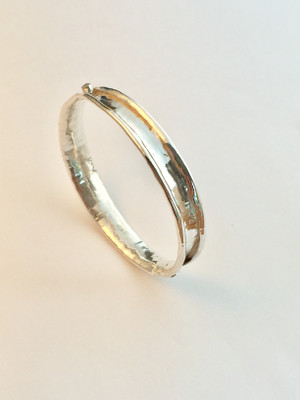 Sterling silver anti-clastic bangle with sapphires