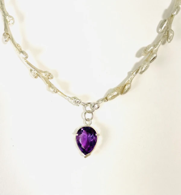 Sterling silver cast branches with faceted amethyst drop