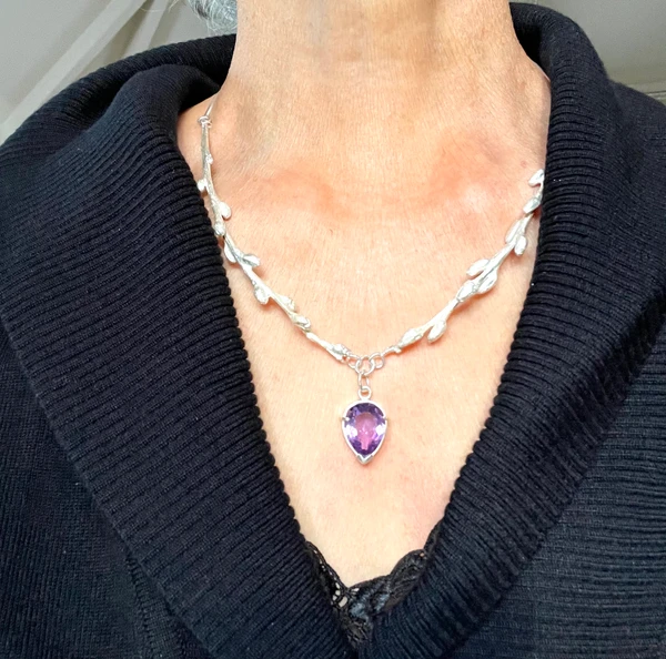 Sterling silver cast branches with faceted amethyst drop