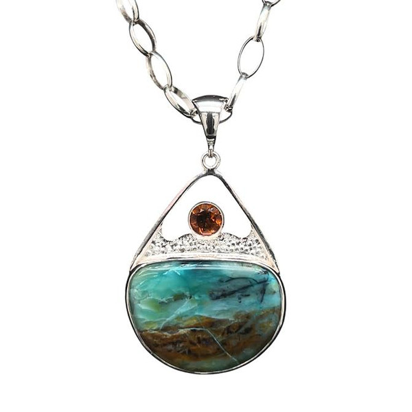 Opalized Wood and Citrine Pendant.
I cut this cool ocean scene opal from a petrified wood specimen from Indonesia. Patterned with waves and a bright Madera Citrine from Brazil.
Looks like the perfect tropical sunset on vacation! 1.5”H x 1”W. Comes with an 18” silver chain.