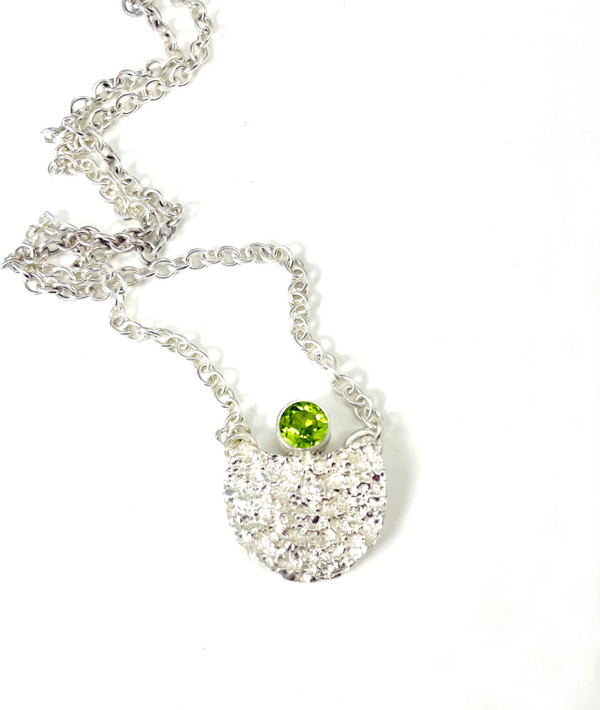 Sterling silver textured half moon pendant with faceted peridot