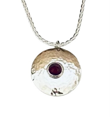 SS locket pendant - round w/ round pointed garnet cabochon