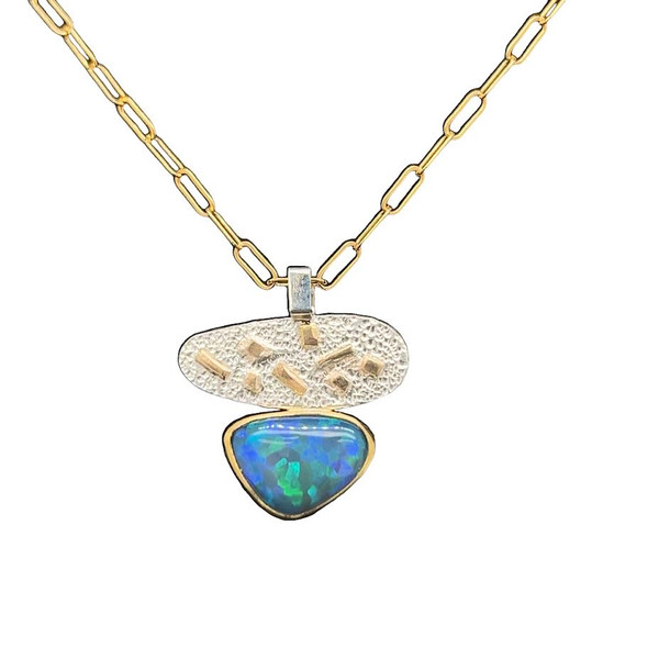 Welo Opal Pendant with 22K gold and silver. Extremely bright opal I cut from Ethiopia with intense blue and green patterned flashes. Set in a 22K high gold bezel and 14K gold backplate. Small highlights are done in 18K gold on a silver textured sheet. Comes with 18” gold filled chain.