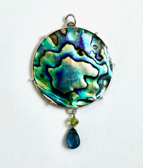 Paua shell pendant with blue topaz drop