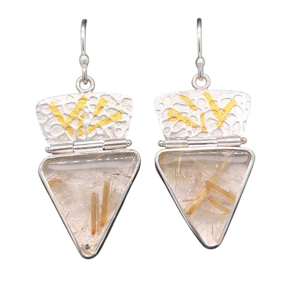 Golden Rutilated Quartz Earrings. Cut this matching pair of golden rutile quartz from Brazil. Rutile are inclusions of Titanium crystals embedded in clear gemmy quartz. Textured silver with 22K gold accents and hinged for delicate movement.