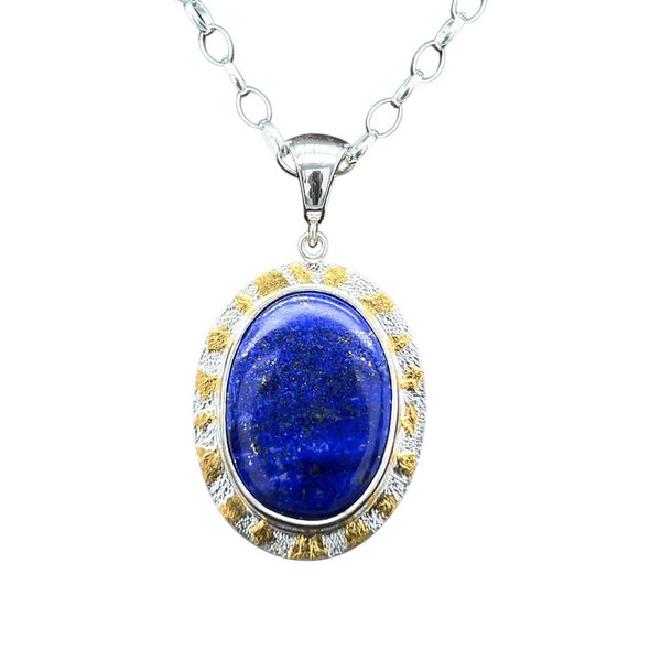 Lapis Pendant with Gold.
I cut this Lapis from rough acquired at the ancient mines in Afghanistan. Rich Royal blue color with attractive gold flecks of pyrite included throughout the stone. Set in pure silver bezel and highlighted with 22K gold using the Korean Keumboo technique. Sterling silver components with 18” chain included.