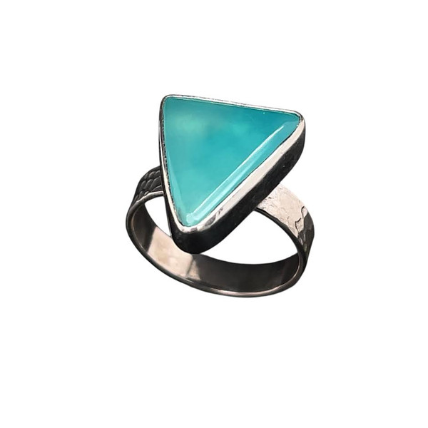 Smithsonite Ring. I cut this rare Smithsonite specimen from New Mexico. It is very uncommon to find this collector stone. I love the blue textured glow that the stone emits. Set in pure silver with sterling silver shank in a size 
6 ¾ Ring.