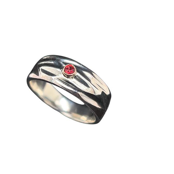 Handcut ring with Ruby. I cut wax by hand and casted this pattern into this tapered ring. Set with a really bright Ruby from Vietnam. Size 6.5