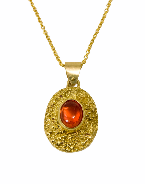 Stunning  18k textured pendant with a Mexican fire opal on an 18K chain.  Chain priced separately.