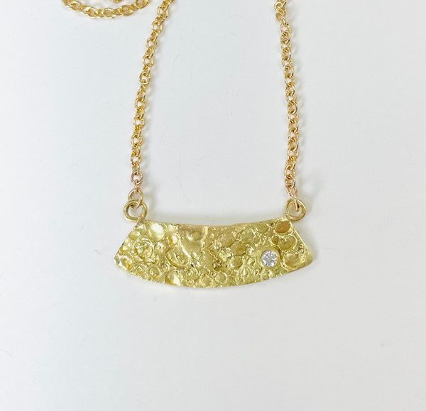 18K gold textured pendant with diamond