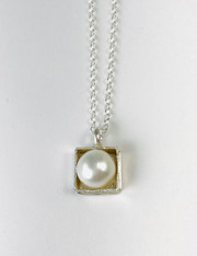 Sterling silver pendant with a pearl in a box