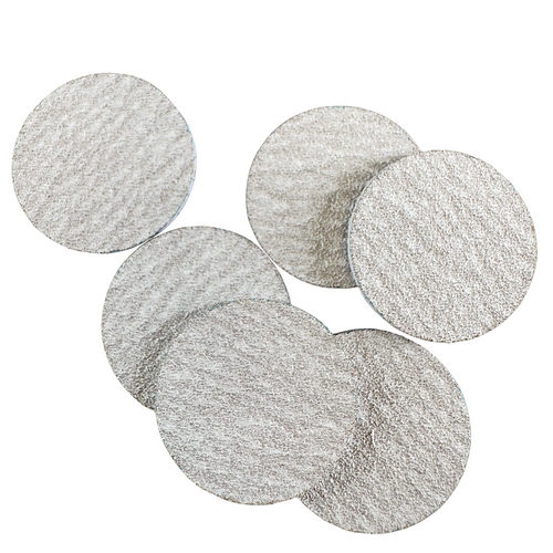 Katie Barnes round e-file sanding discs with 240 grit on a white a background.