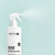 Sienna X exfoliating preparation spritz 500ml sprayed against a blue background