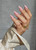 Hand with The GelBottle Inc gel nail polish on the nails in the shade, La Vie En Rose.