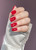 Hand with The GelBottle Inc gel nail polish on the nails in the shade, Couture.