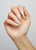 Hand with The GelBottle Inc BIAB™ builder gel on the nails in the shade, Bella.