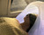Hair and Nature Japanese head spa bed package in black with a woman wearing an eye mask and towel.