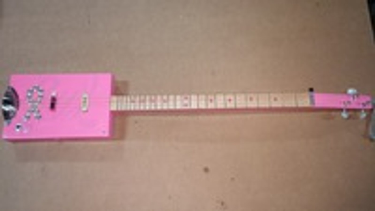 The Greatest Gift of All is the Act of Giving: Mike Boswell and his Breast Cancer Awareness Guitar