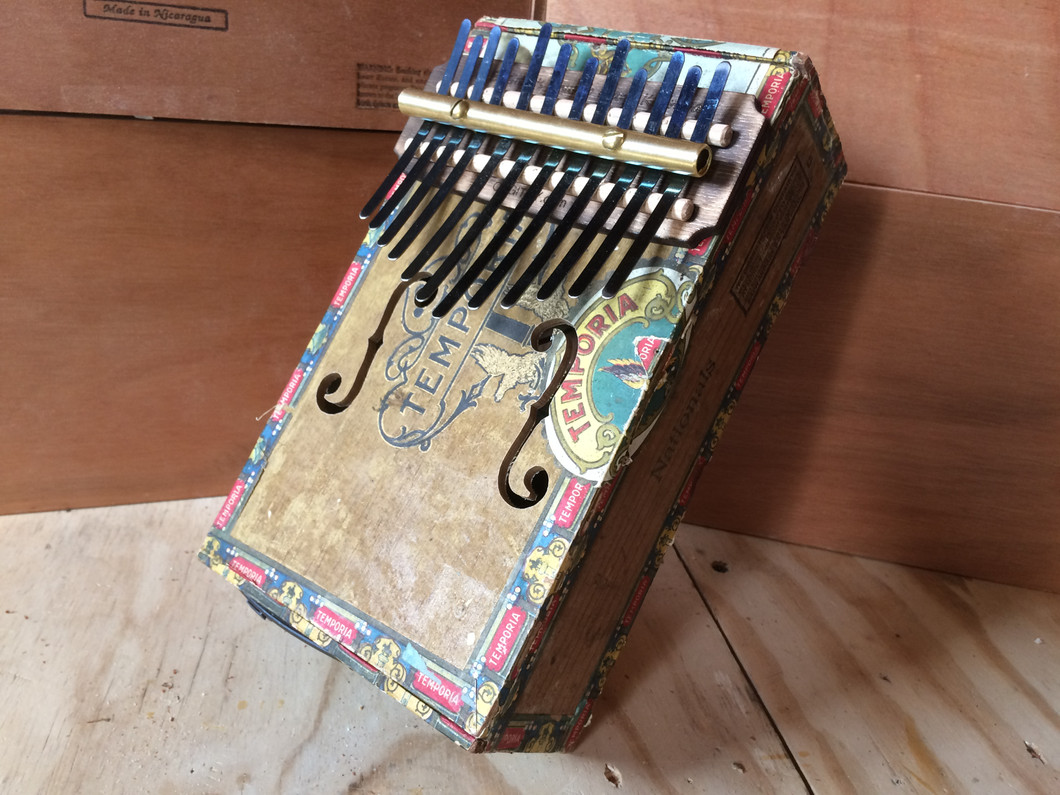 Cigar Box Kalimba BLUES! How to change the tuning to an A Minor Blues Scale