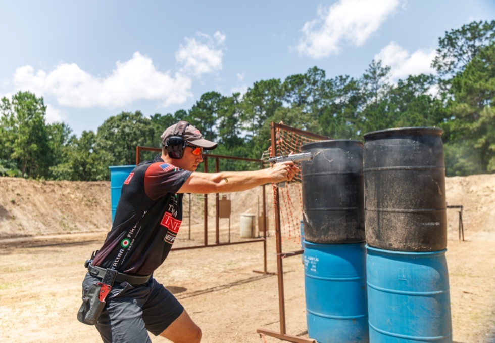 Team Tanfoglio competitor engaging a stage at a practical shooting match
