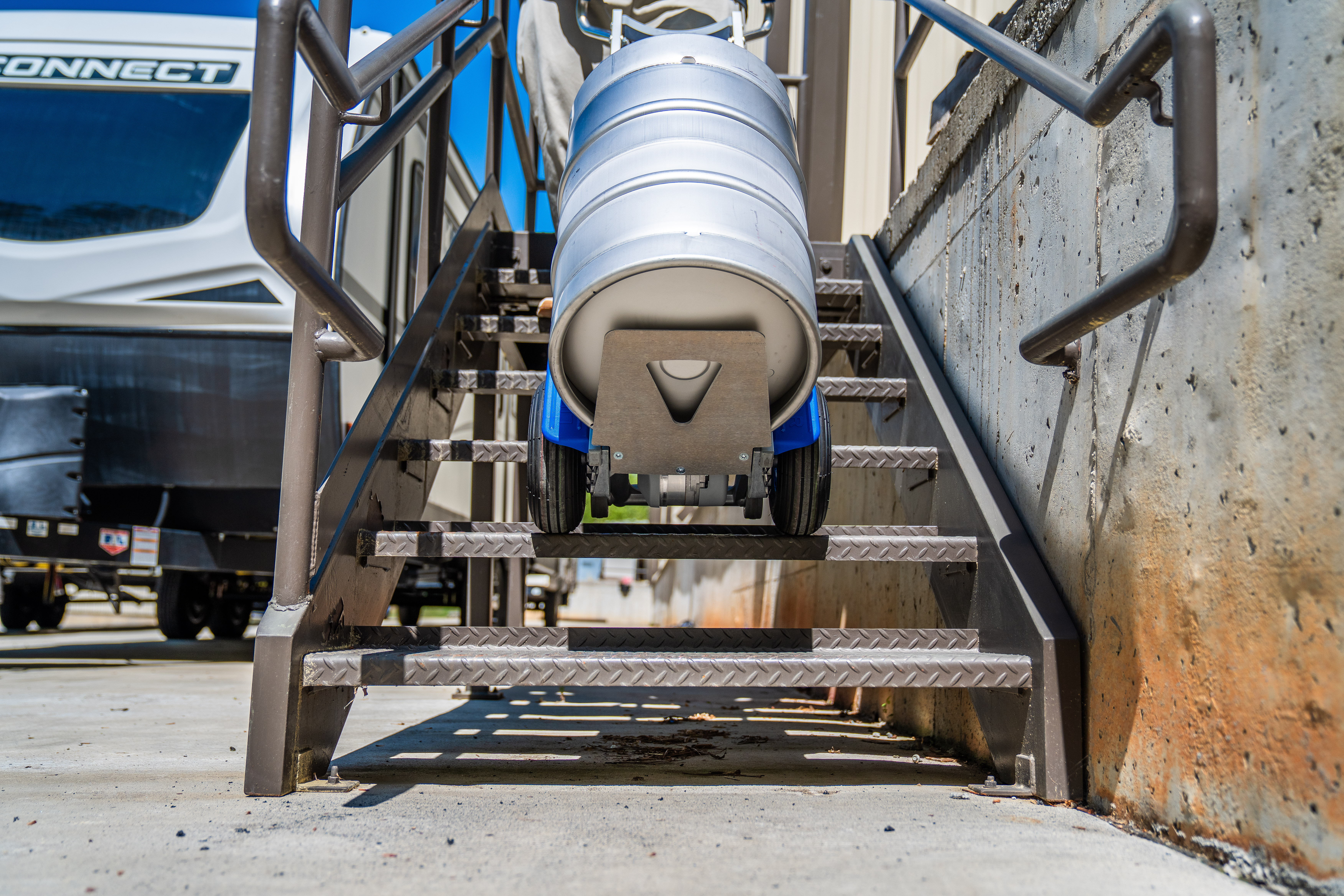 SANO stairclimber carrying keg down stairs
