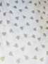white and gold ladybeetle cotton fabric
