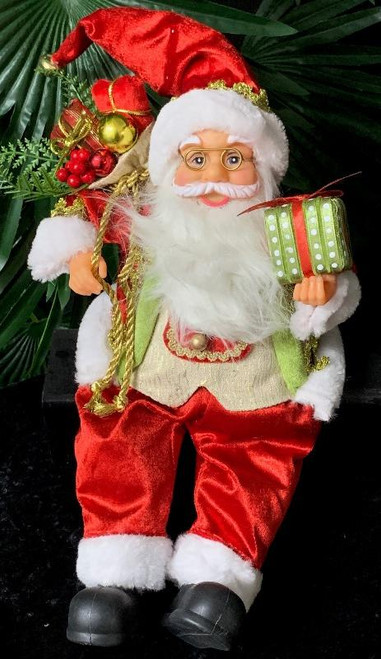 Sitting Santa holding present approx 40cm tall