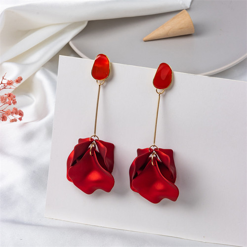 long earrings with pearly red petals hung from gold coloured rod beneath an acrylic stud on s925 posts
