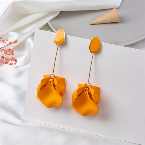 long earrings with orange petals hung from gold coloured rod beneath an acrylic stud on s925 posts