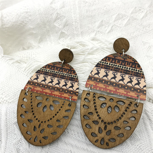Wooden Oval retro geometric and stripe pattern earrings hung from round stud on posts - brown wood colour with dancing person pattern