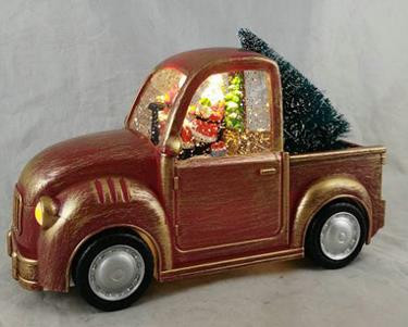 Christmas Santa in truck towing christmas tree with LED lights