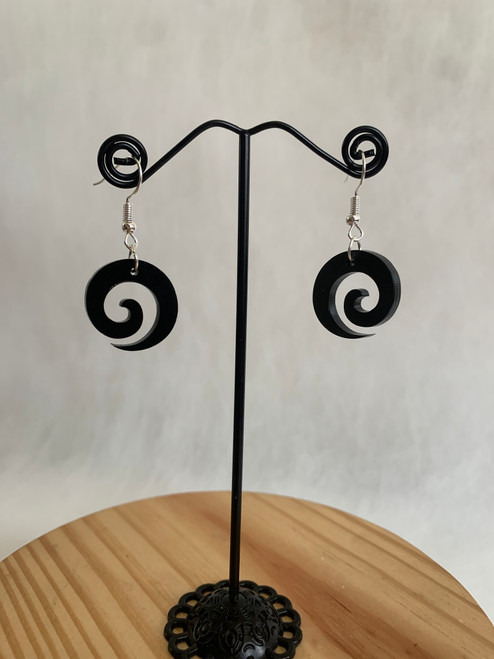 Koru black acrylic earrings on hook