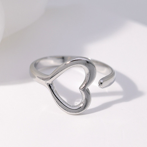 Silver hollow heart ring with adjustable opening