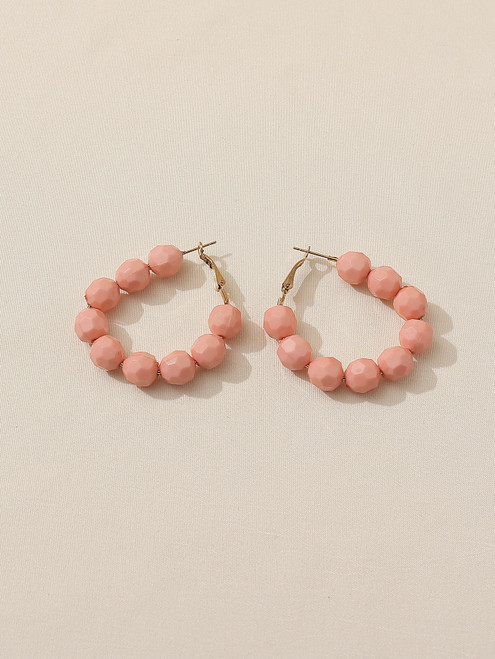 Round beaded hoop earrings in pink