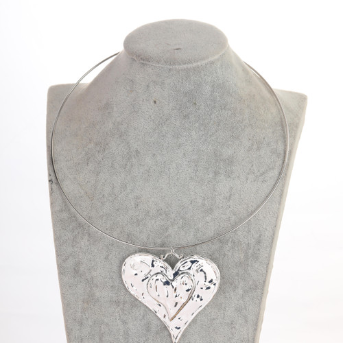 Silver coloured solid textured heart pendant on choker