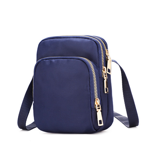 Small crossbody bag with three zip-up pockets - navy blue