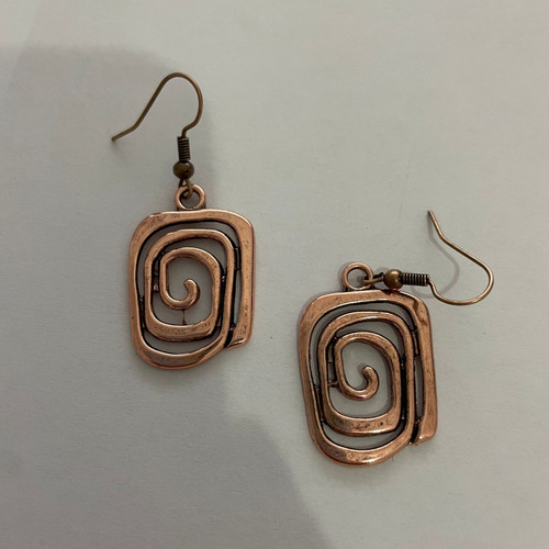 Rose gold coloured spiral earrings on hooks