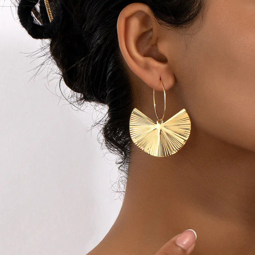 Gingko leaf style gold coloured earrings on hoops