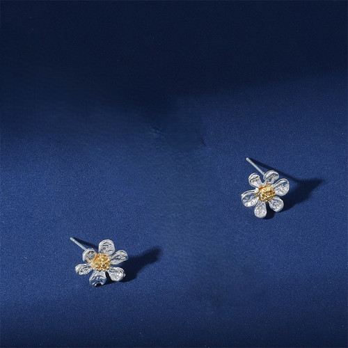 Silver coloured daisy stud earrings on posts