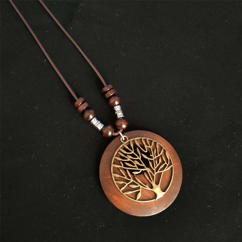 Wooden pendant with antique look tree of life on brown cord