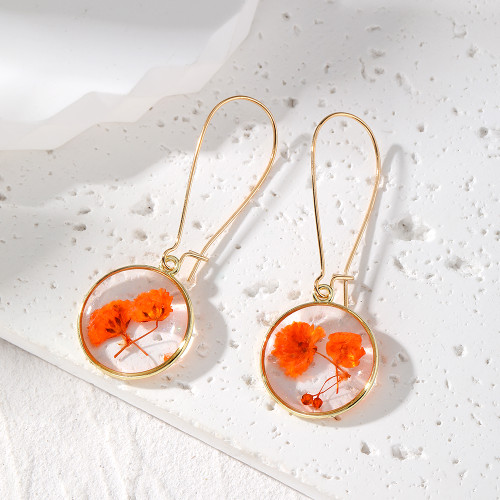 Orange dried flower resin drop earrings on long hoop clasp