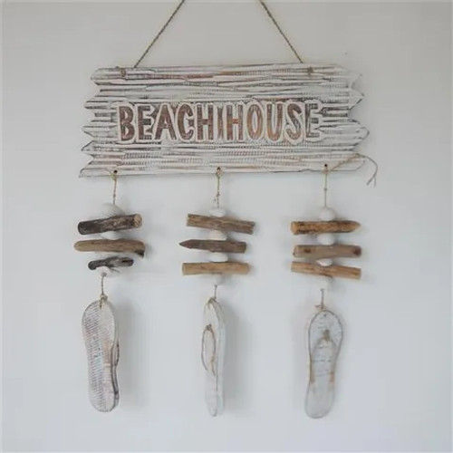 Hanging wooden "Beach House" sign with jandal strands